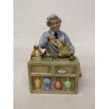 A ROYAL DOULTON FIGURE "THE CHINA REPAIRER" HN 2943