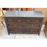A MODERN HARDWOOD SIDEBOARD ENCLOSING 4 SHORT AND 4 LONG DRAWERS, 47" WIDE
