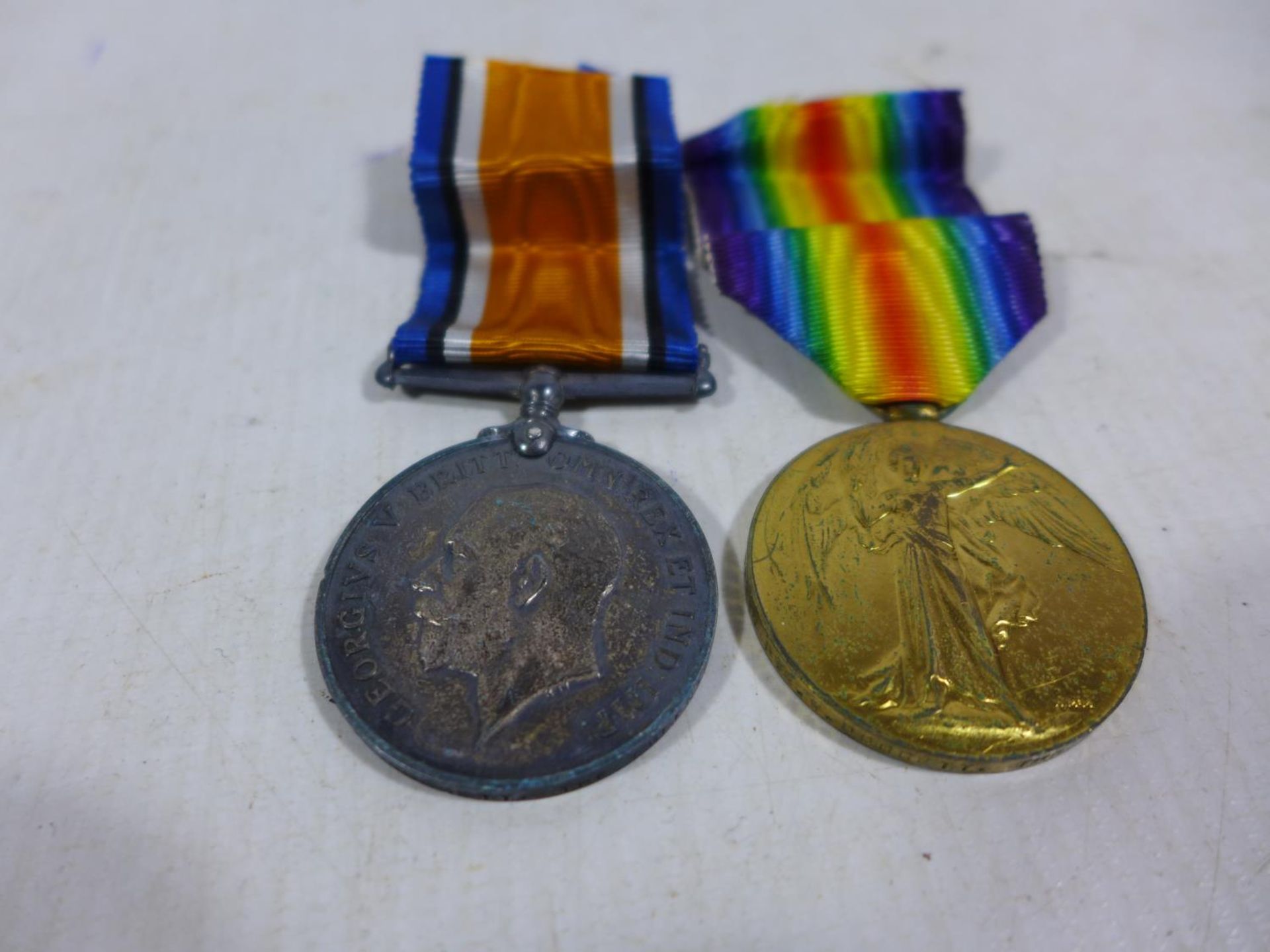 A WORLD WAR I MEDAL PAIR AWARDED TO 46924 PRIVATE W DOGGETT OF THE QUEENS REGIMENT