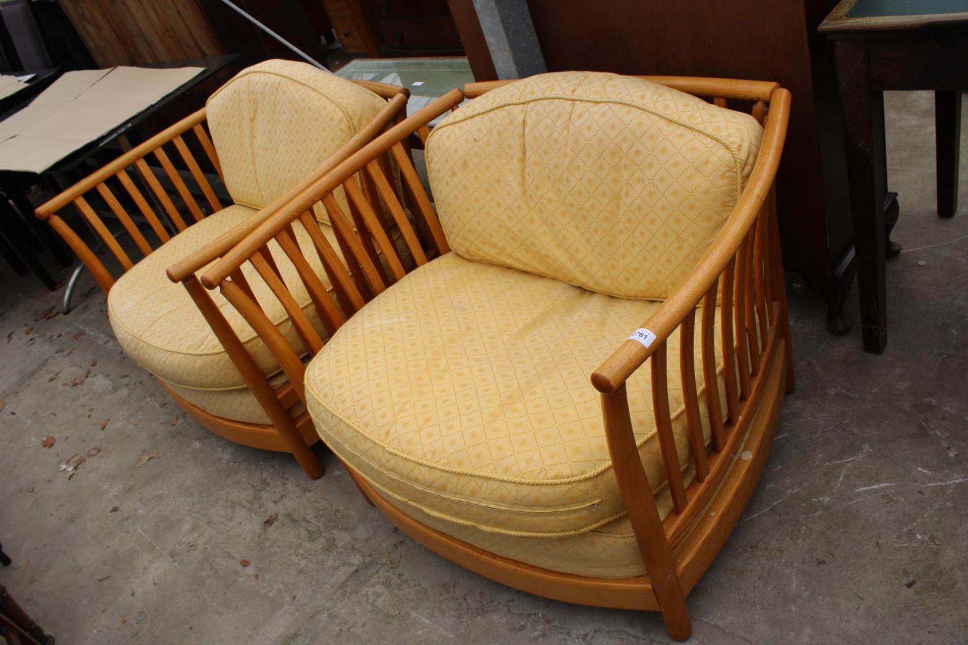 A PAIR OF ERCOL RENAISSANCE LOW BACK EASY CHAIRS