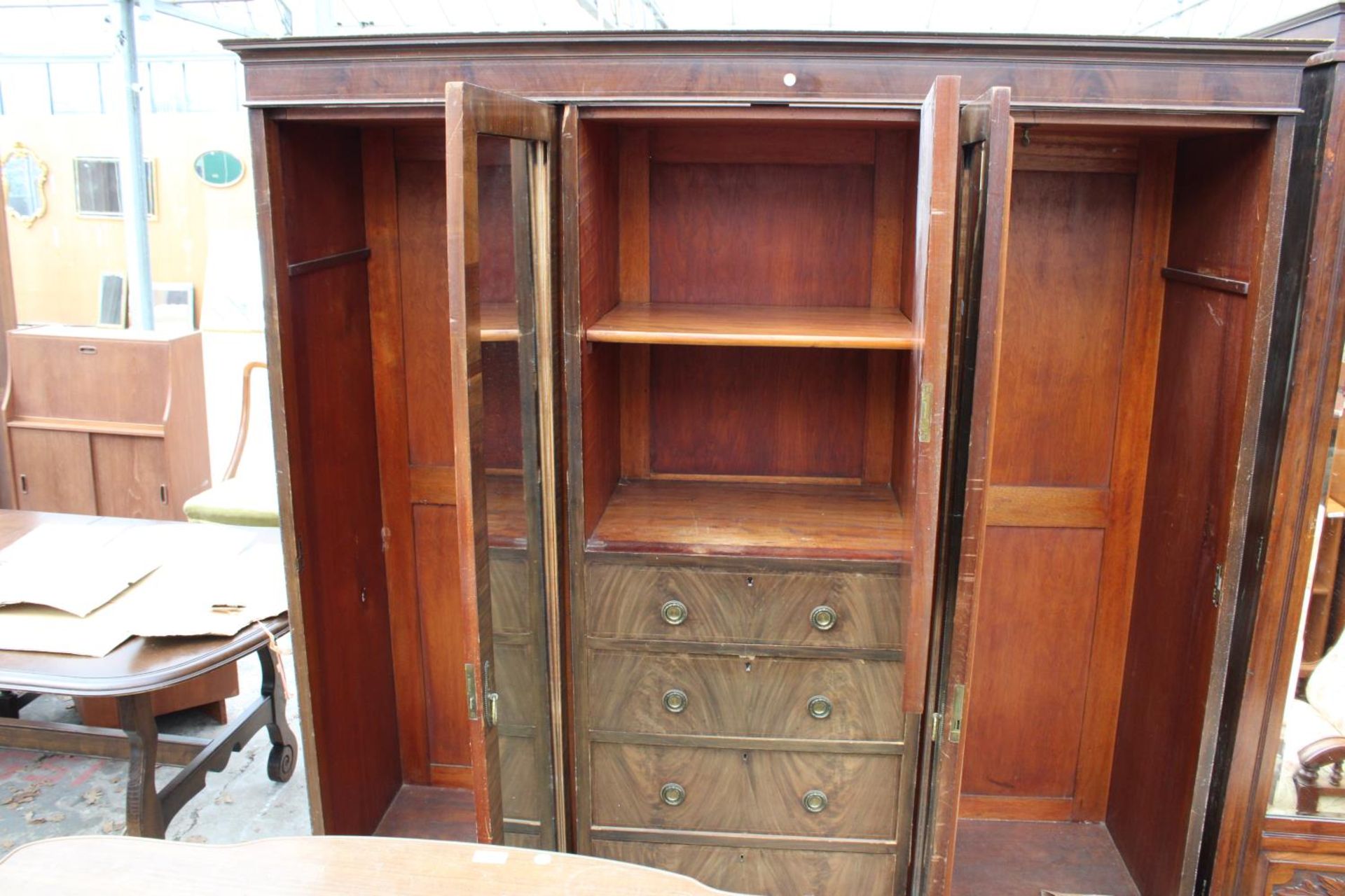 AN EDWARDIAN MAHOGANY DOUBLE MIRROR-DOOR WARDROBE ENCLOSING CUPBOARDS AND FOUR GRADUATED DRAWERS, - Image 3 of 4