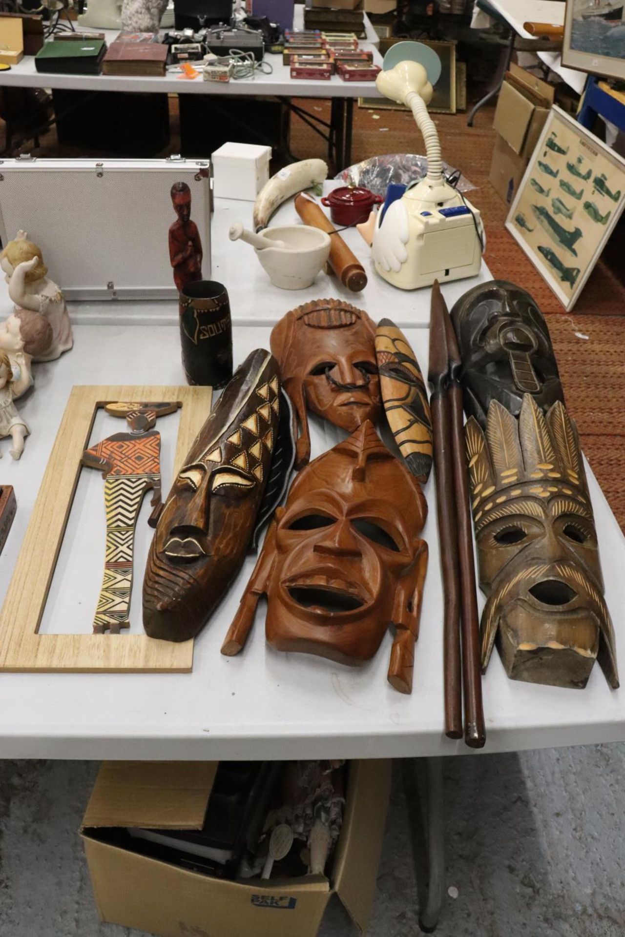 A LARGE COLLECTION OF AFRICAN MASKS, ETC