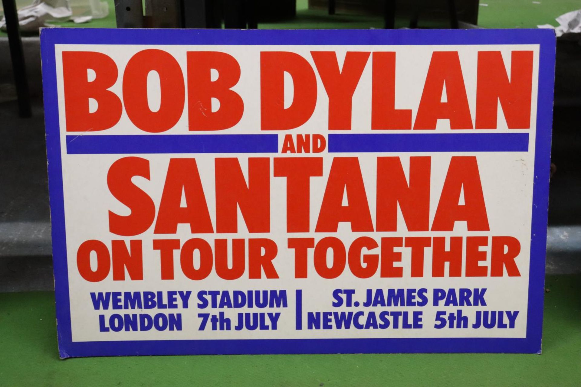 A VINTAGE "BOB DYLAN AND SANTANA" TOUR ADVERT ON BOARD