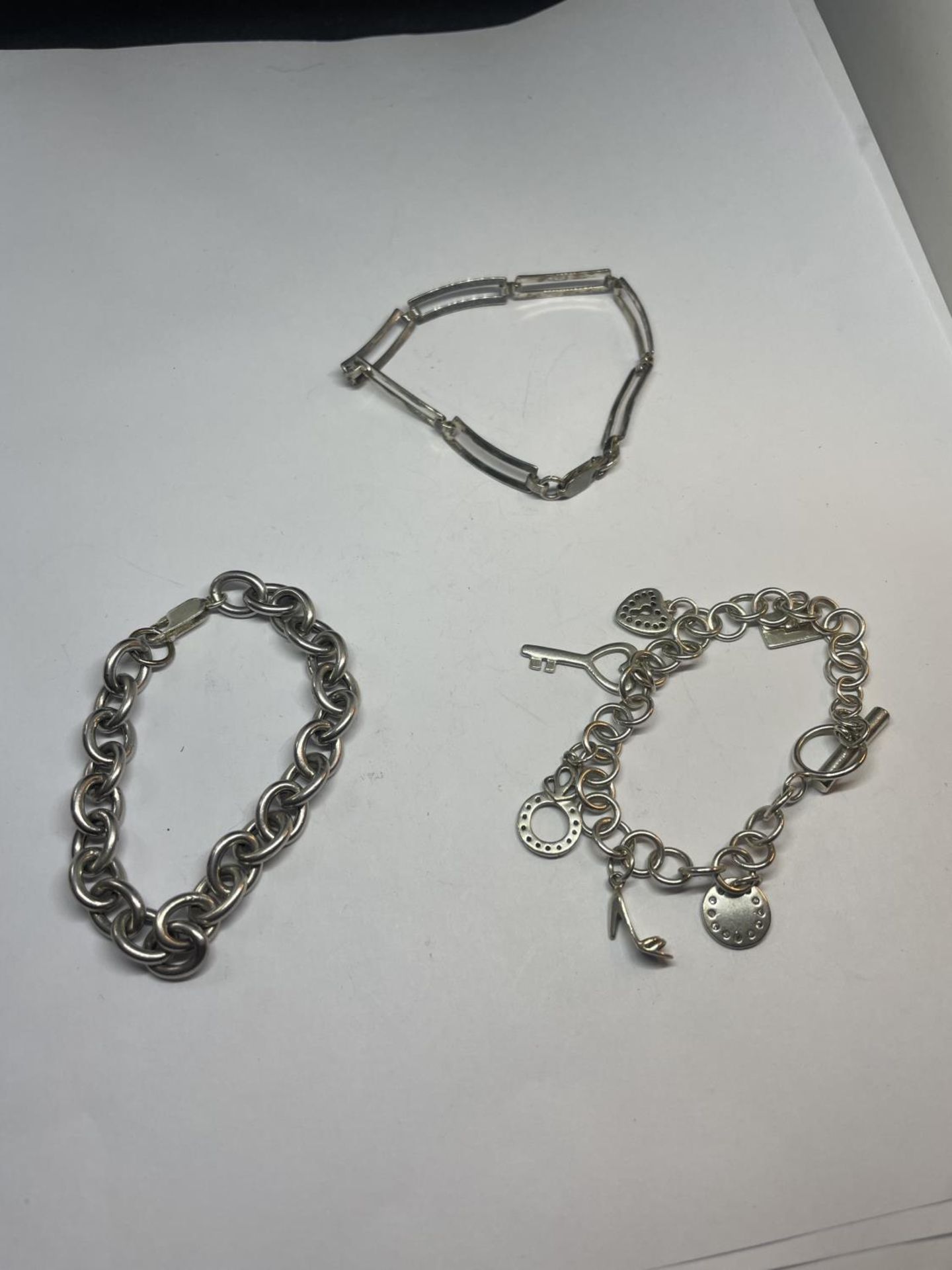 THREE SILVER BRACELETS