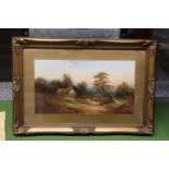 AN OIL ON BOARD OF A COUNTRY SCENE, IN A GILT FRAME, 64CM X 42CM