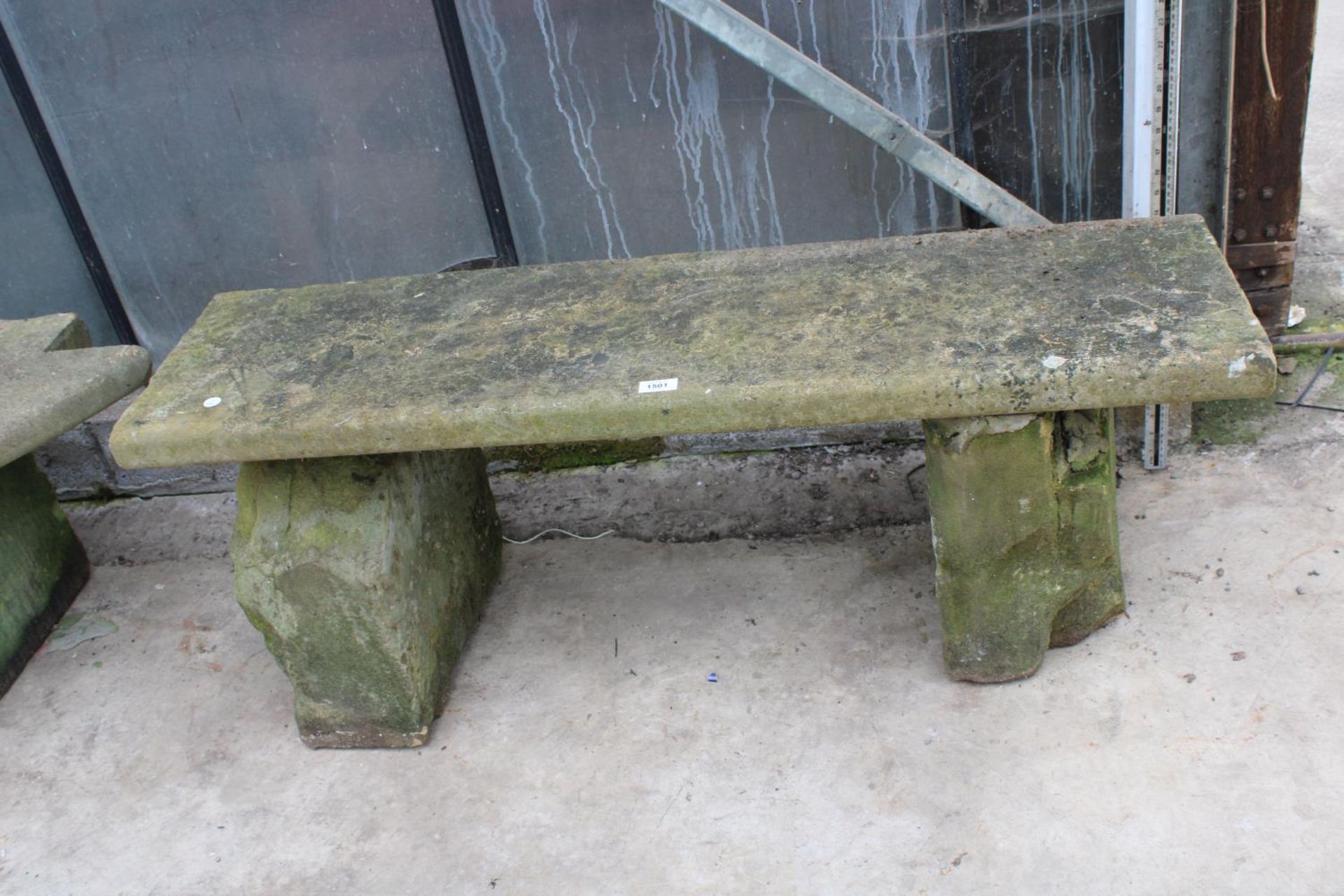 A YORK STONE BENCH WITH TWO PEDESTAL BASES (L:118CM)