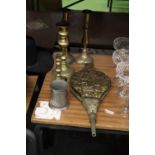 A MIXED LOT OF BRASSWARE TO INCLUDE FOUR CANDLE STICKS, A BRASS AND LEATHER FIRE BELLOWS PLUS A