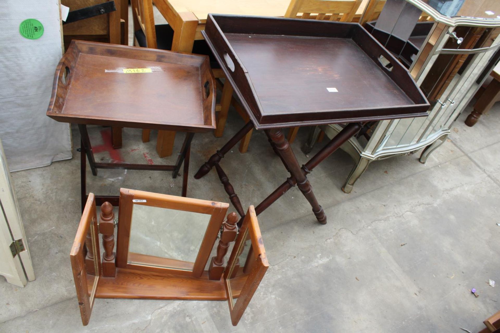 TWO GEORGIAN STYLE BUTLERS TRAYS ON FOLDING STANDS AND A PINE TRIPLE MIRROR
