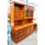 A MODERN YEW WOOD LOUNGE/COCKTAIL UNIT WITH PARTIALLY GLAZED UPPER PORTION, 61" WIDE