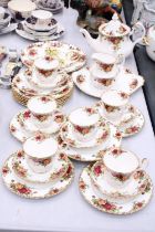 A ROYAL ALBERT 'OLD COUNTRY ROSES' TEASET TO INCLUDE A TEAPOT, CREAM JUG, SUGAR BOWL, CAKE PLATES,