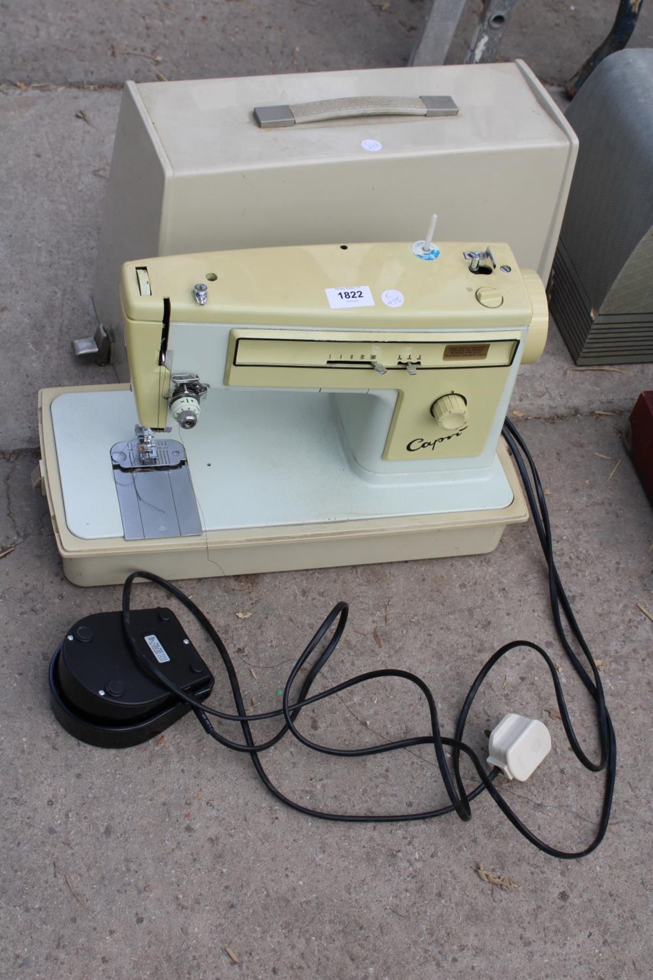 A CAPRI ELECTRIC SEWING MACHINE WITH FOOT PEDAL AND CARRY CASE