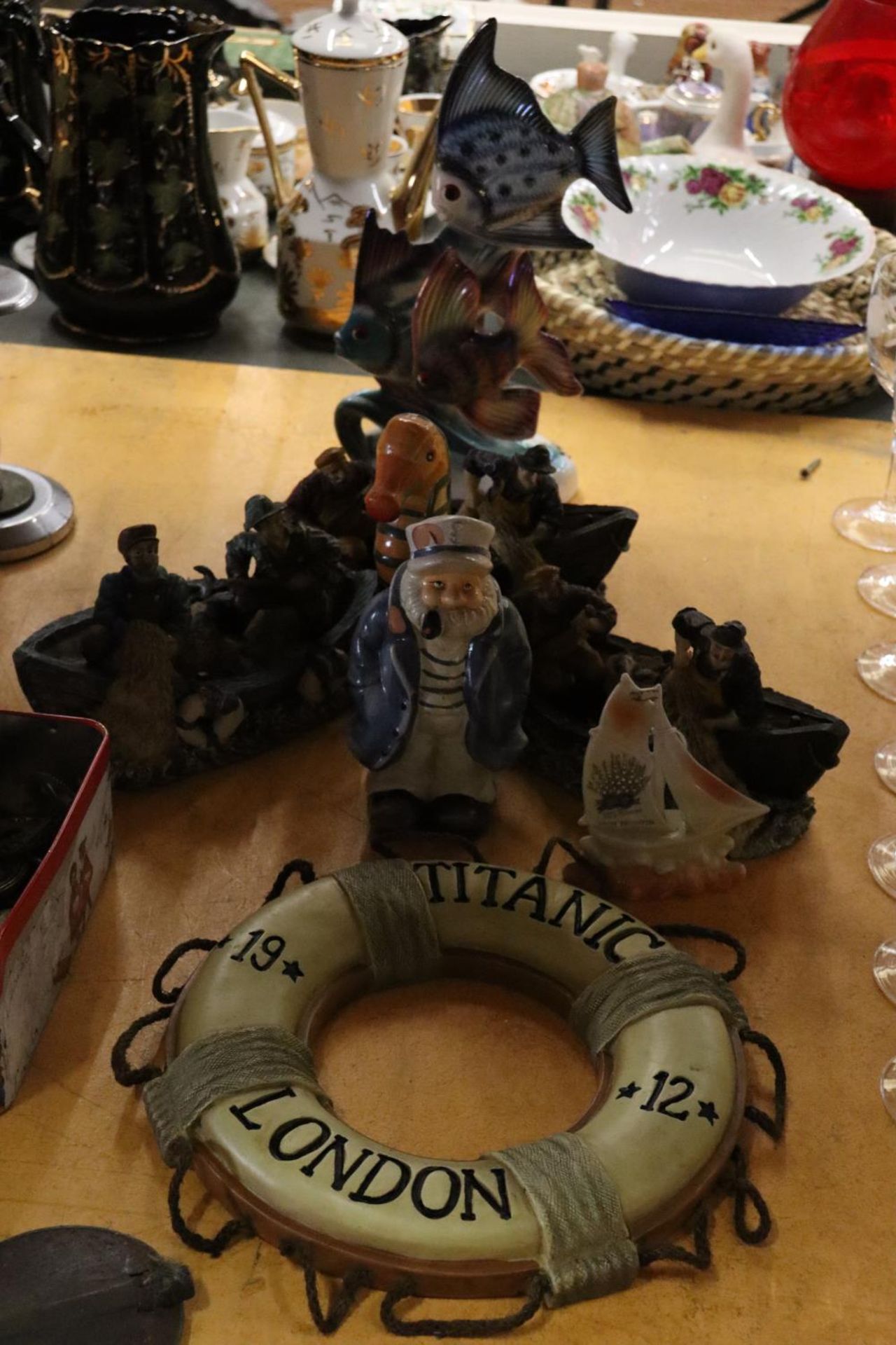 A COLLECTION OF NAUTICAL THEMED FIGURES