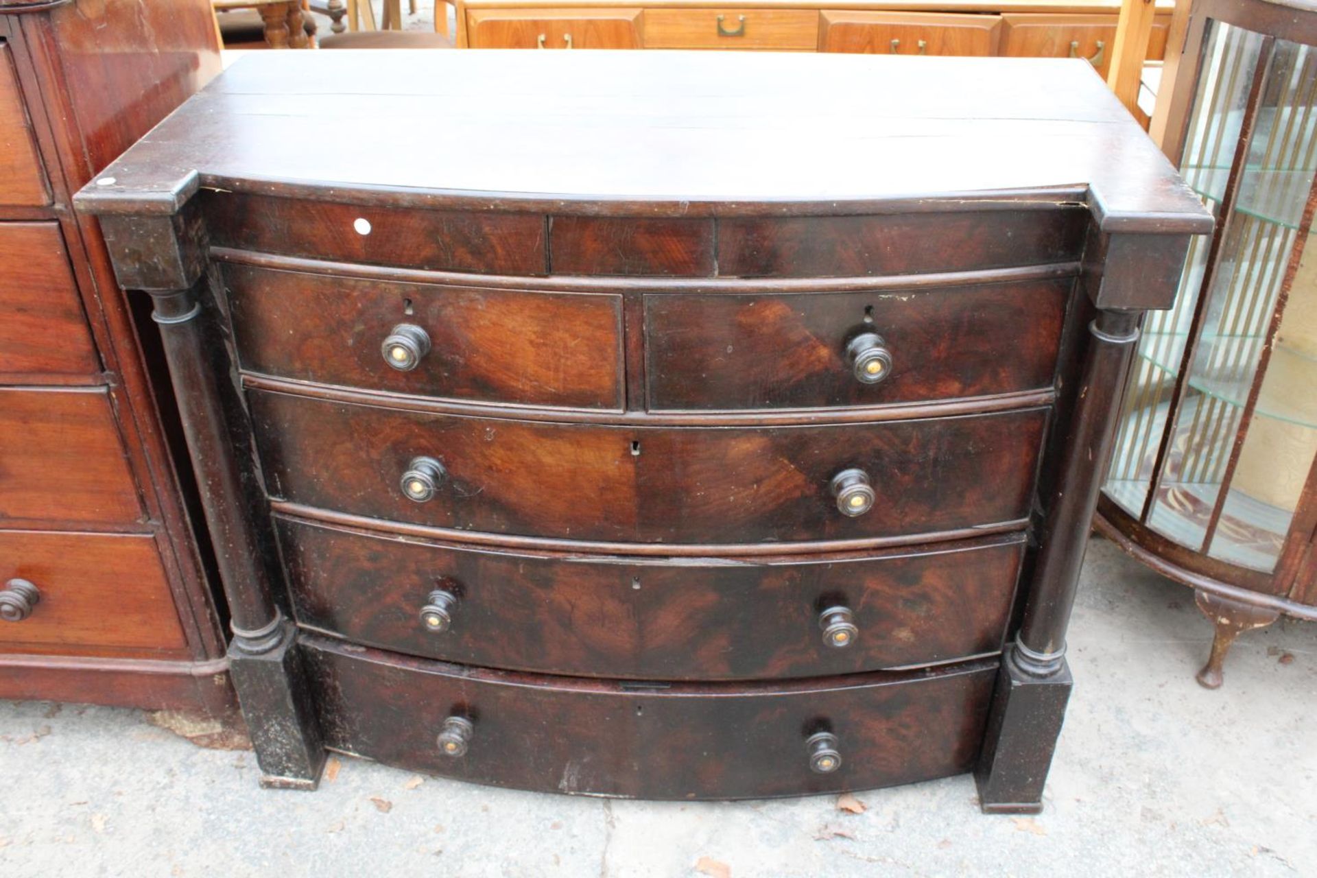 A VICTORIAN MAHOGANY BOW-FRONTED CHEST OF 2 SHORT, 3 LONG AND 2 SECRET FRIEZE DRAWERS, 49" WIDE