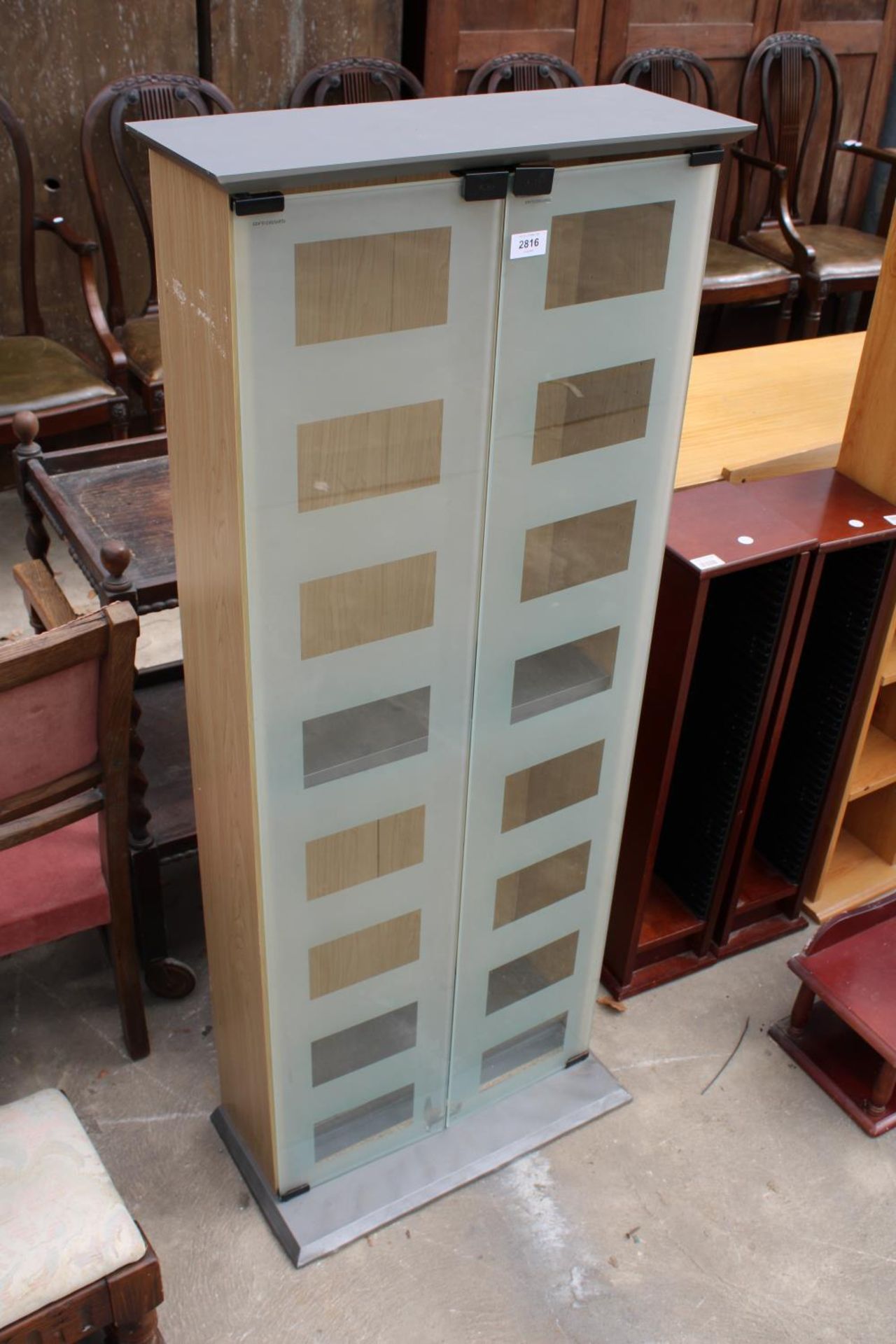 A MODERN DISPLAY CABINET WITH SMOKED GLASS DOORS, 21" WIDE