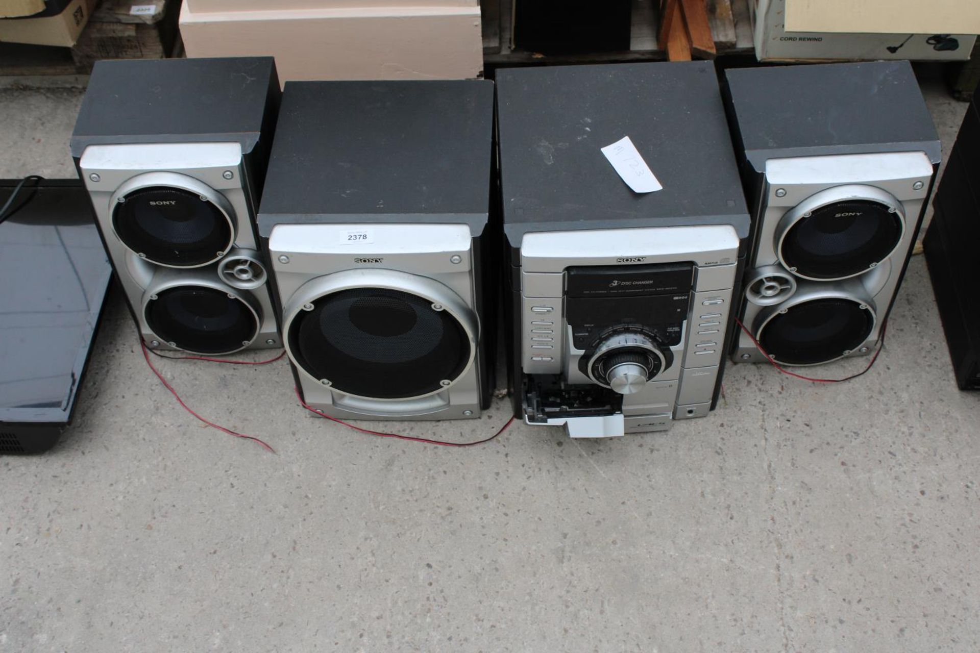 A SONY STEREO SYSTEM WITH THREE SPEAKERS