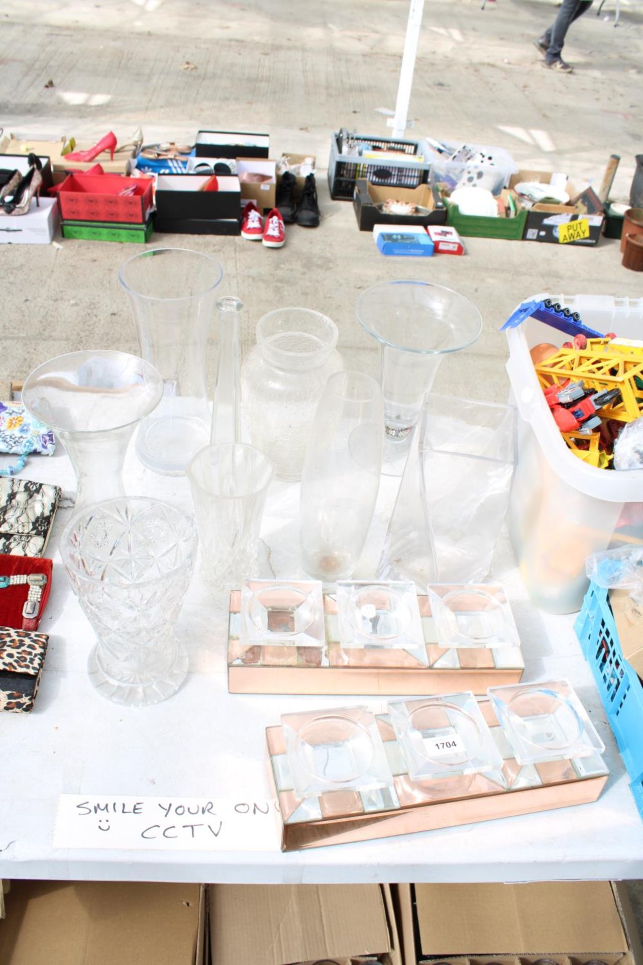 AN ASSORTMENT OF VARIOUS GLASS VASES AND CANDLE HOLDERS ETC