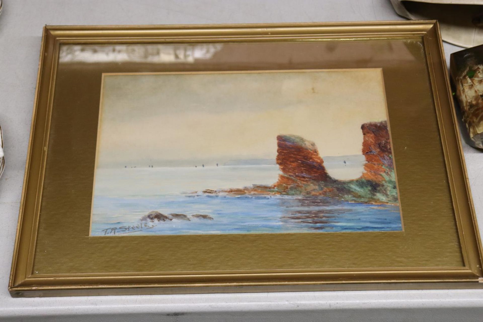 A FRAMED WATERCOLOUR OF A SEA SCENE, SIGNED T R STEELE, 36CM X 26CM