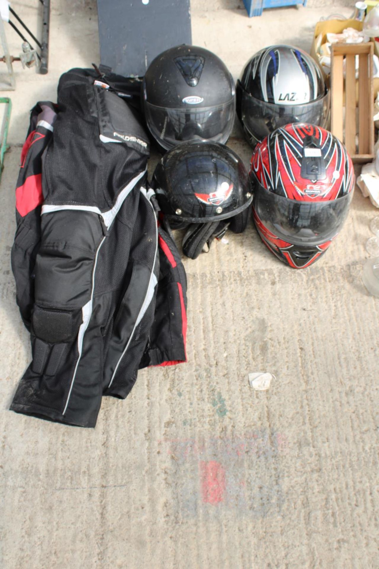 A MOTORBIKE JACKET AND FOUR HELMETS