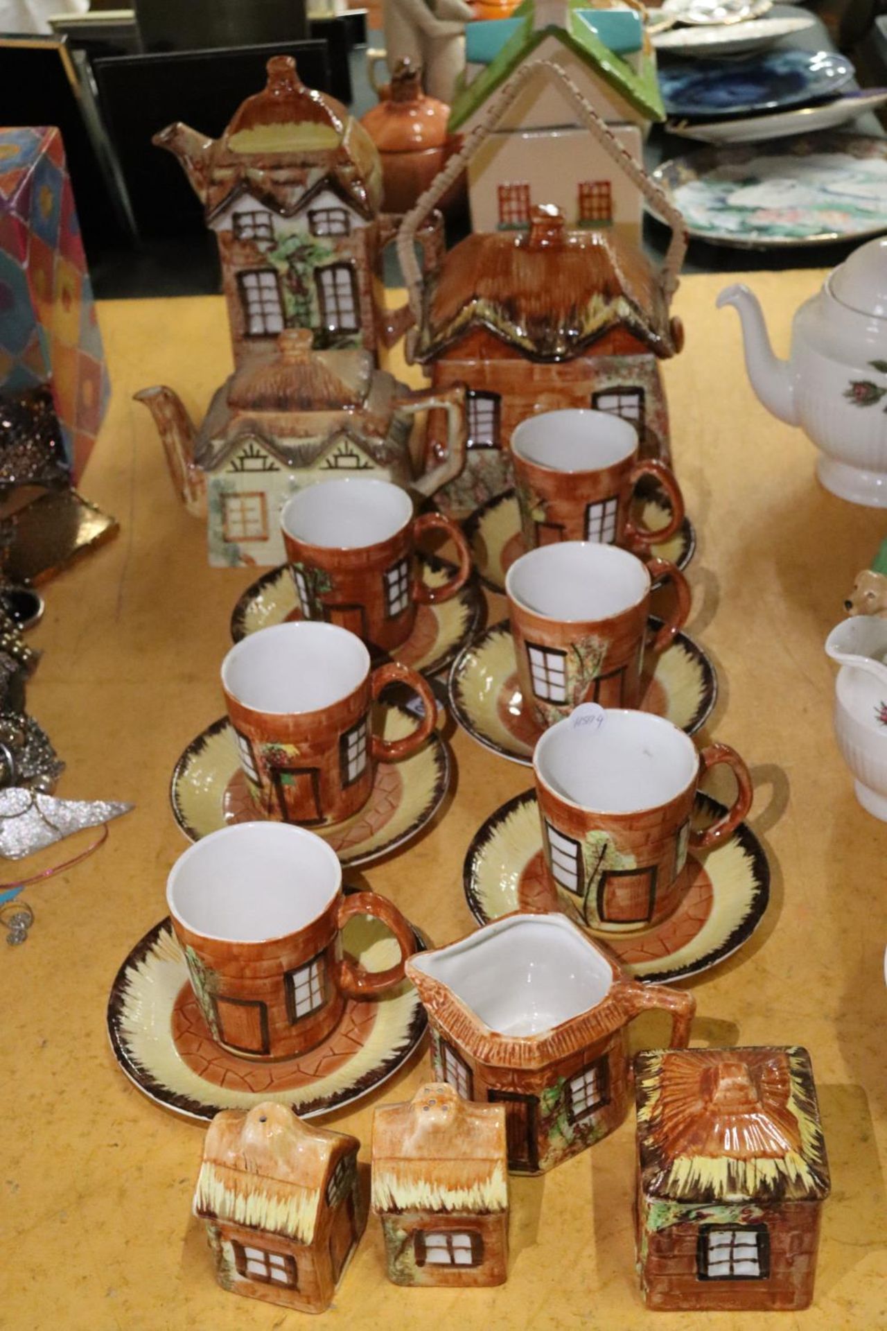 A VINTAGE PRICES, 'COTTAGE' TEASET TO INCLUDE A TEAPOT, COFFEE POT, STORAGE POT, CUPS, SAUCERS, A
