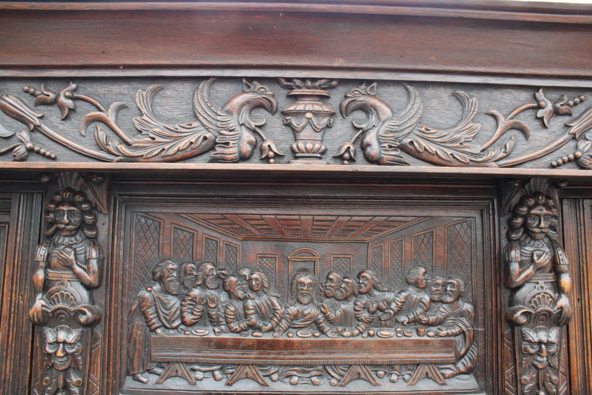 AN OAK GEORGE III STYLE COURT CUPBOARD WITH CARVED PANELS, THREE DEPICTING THE BIRTH AND - Image 12 of 13