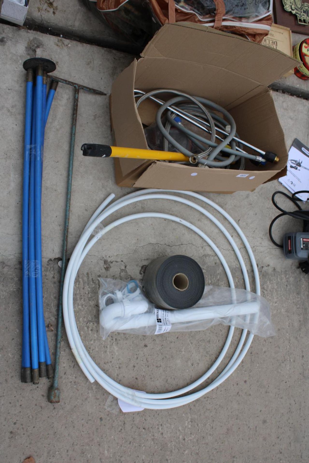 AN ASSORTMENT OF PLUMBING SPARES AND SIX DRAINING RODS