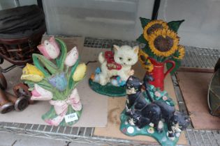 FOUR VARIOUS VINTAGE CAST IRON DOOR STOPS TO INCLUDE CATS AND FLOWERS ETC