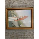 A FRAMED PRINT OF THE RED ARROWS IN FLIGHT FORMATION