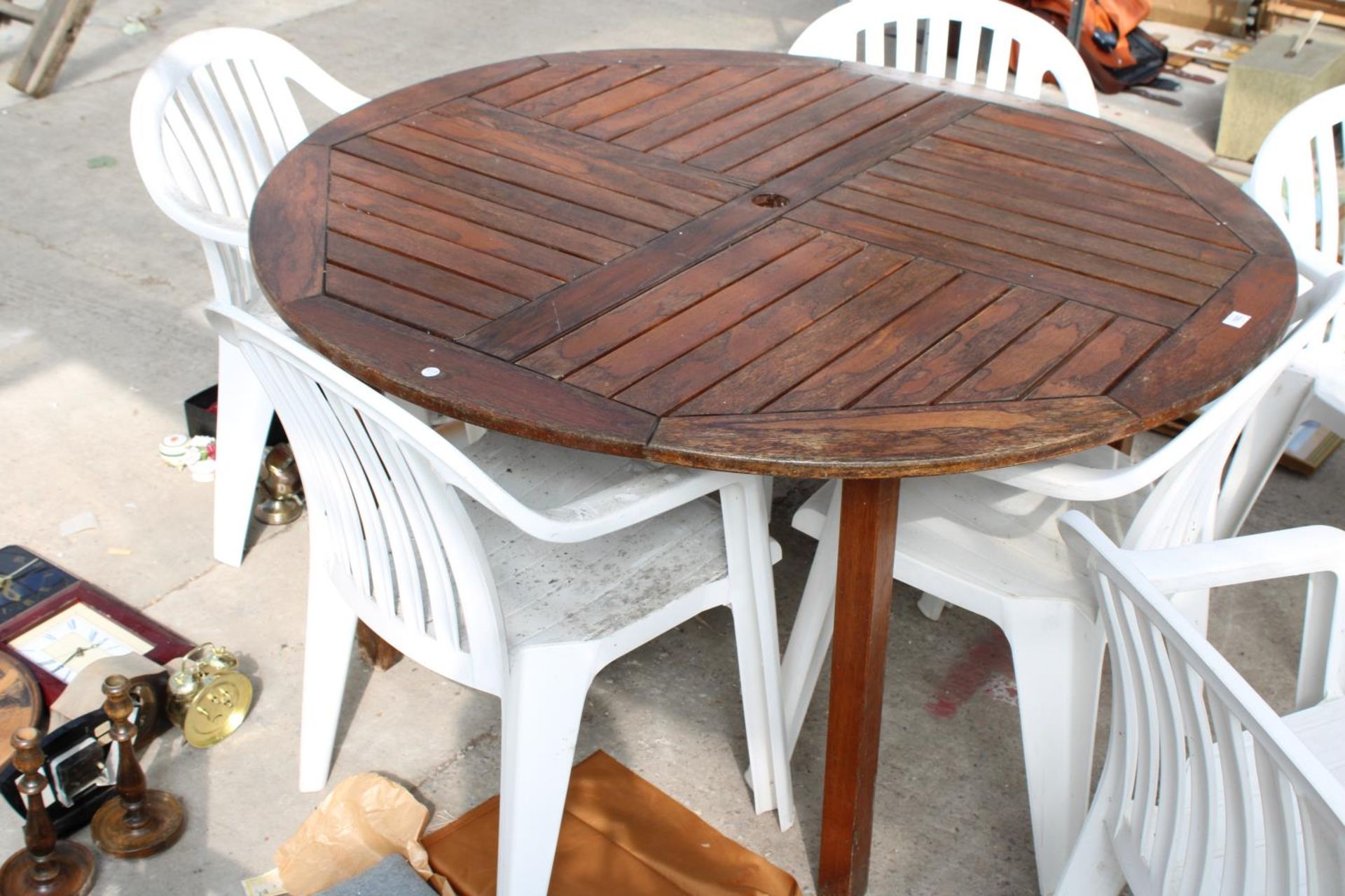 A TEAK GARDEN TABLE WITH SIX PLASTIC STACKING CHAIRS - Image 3 of 3
