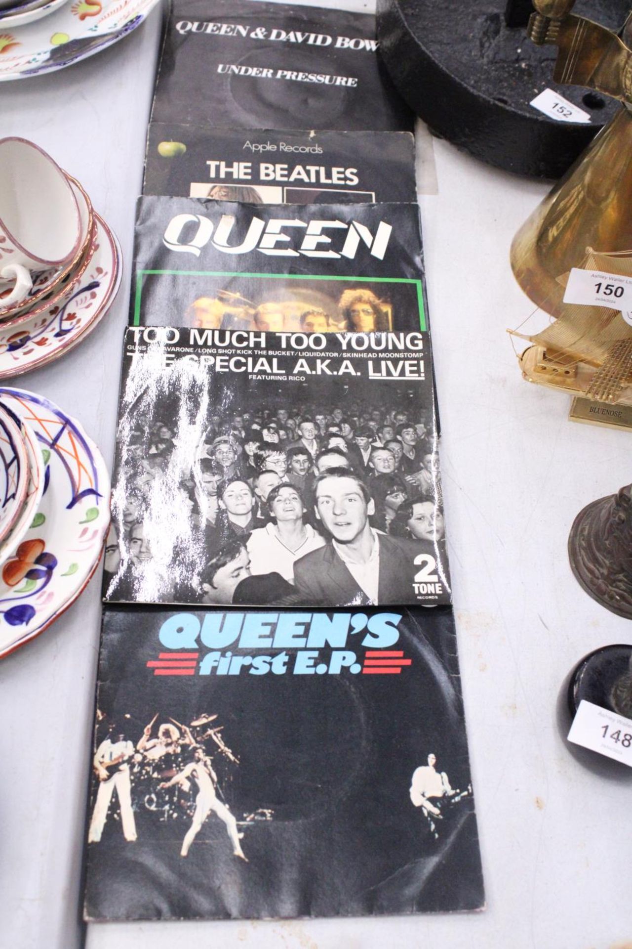 FIVE VINYL RECORDS TO INCLUDE QUEEN, THE BEATLES AND THE SPECIALS, ETC
