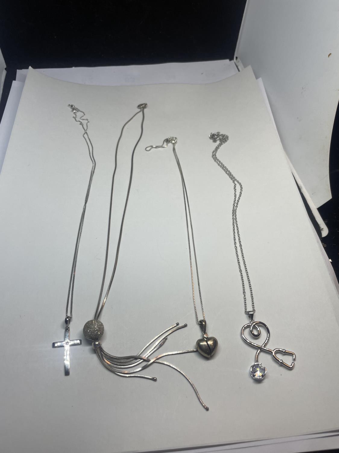 FOUR SILVER NECKLACES