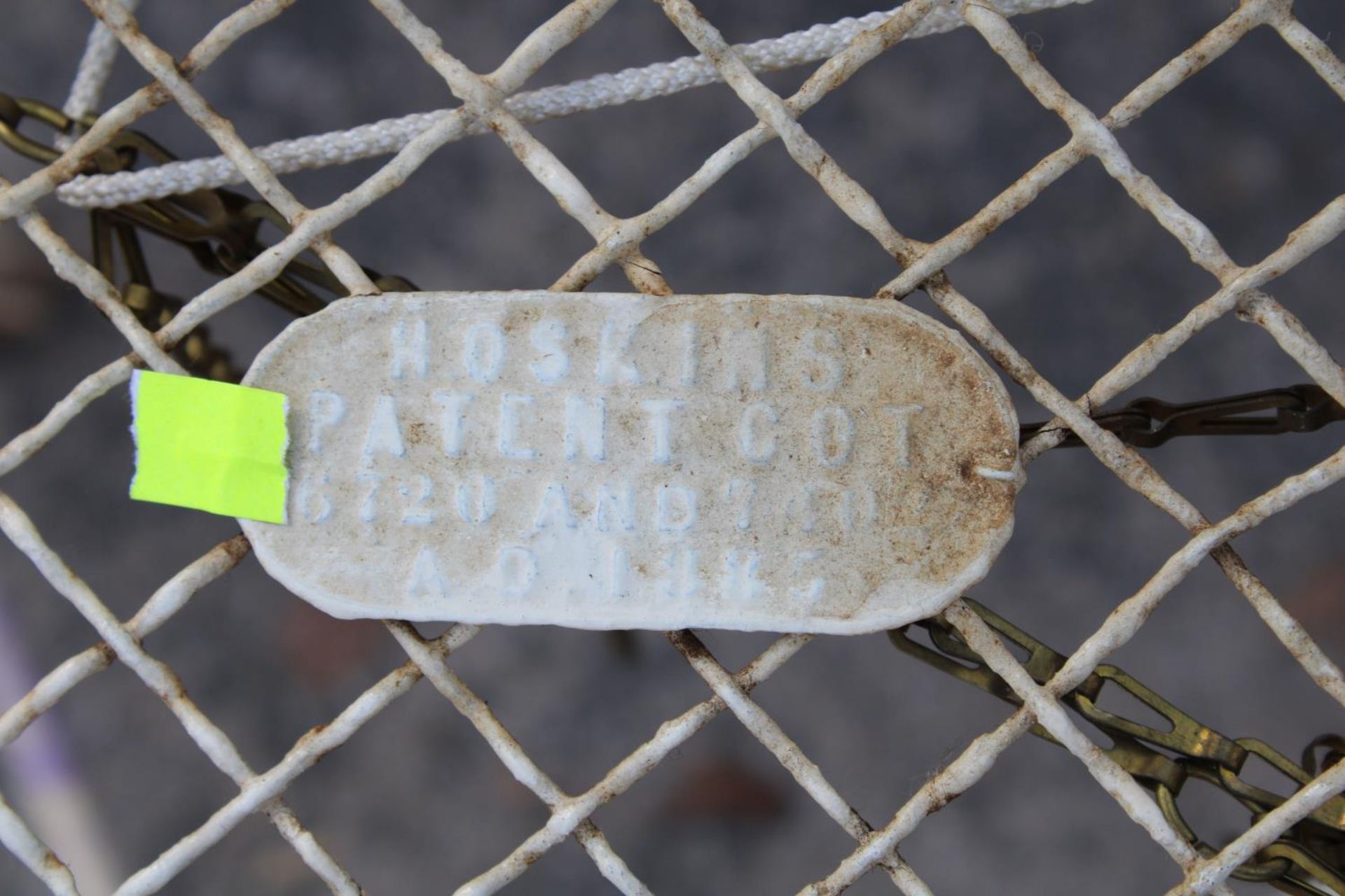 A VICTORIAN CAST IRON FOLDING COT WITH BRASS KNOBS BEARING HOSKINS PATENT COT LABEL - Image 3 of 4