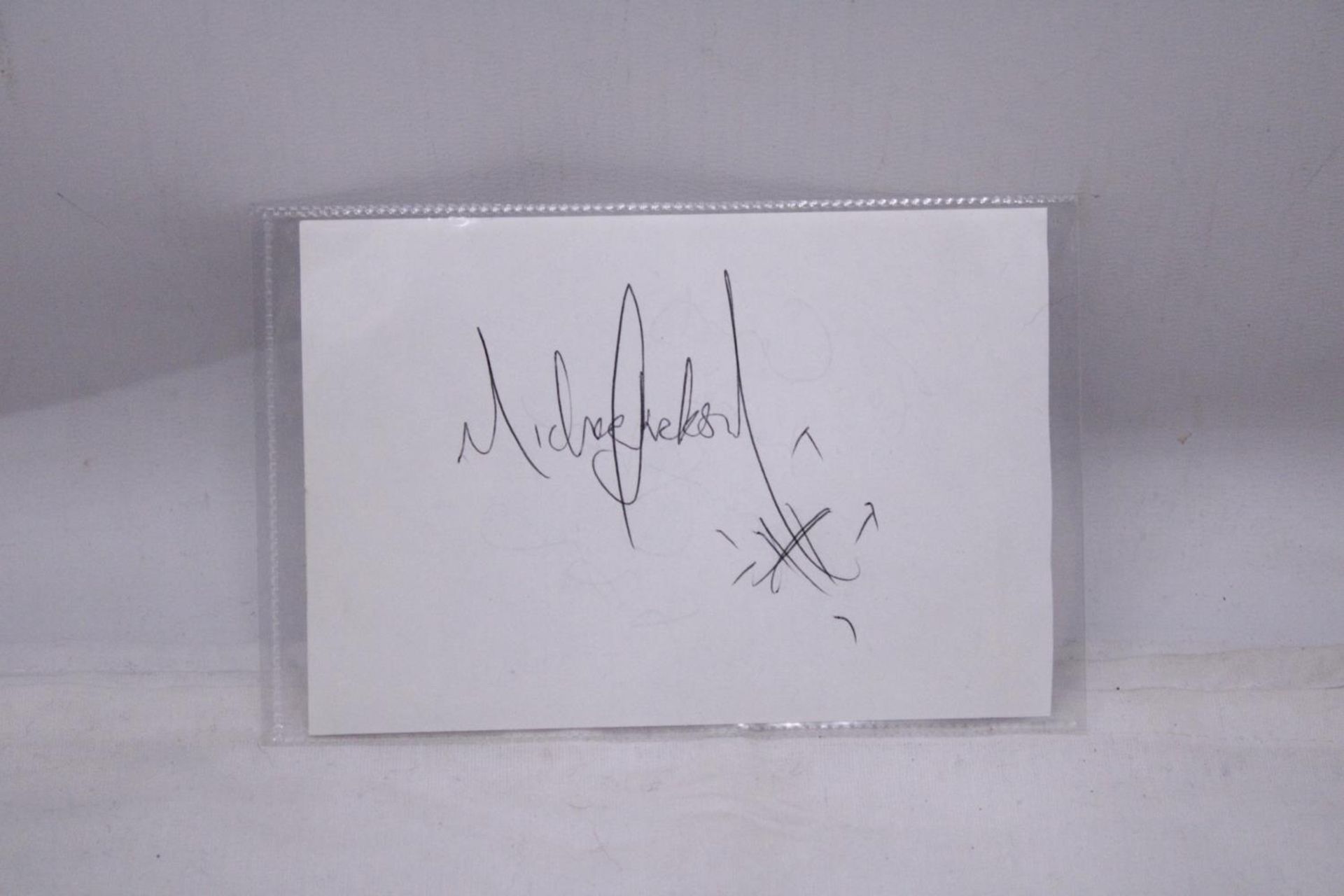 A GENUINE MICHAEL JACKSON AUTOGRAPH, TAKEN OUT OF THE PREVIOUS LOTS AUTOGRAPH BOOK, ORAL PROVENANCE