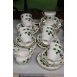 A COLCLOUGH 'IVY LEAF' PART TEASET TO INCLUDE CAKE PLATES, A CREAM JUG, CUPS, SAUCERS AND SIDE