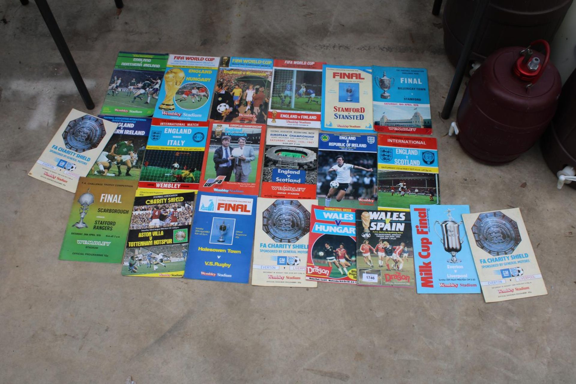 AN ASSORTMENT OF CLUB AND INTERNATIONAL FOOTBALL PROGRAMMES TO INCLUDE A 1984 MILK CUP FINAL GAME