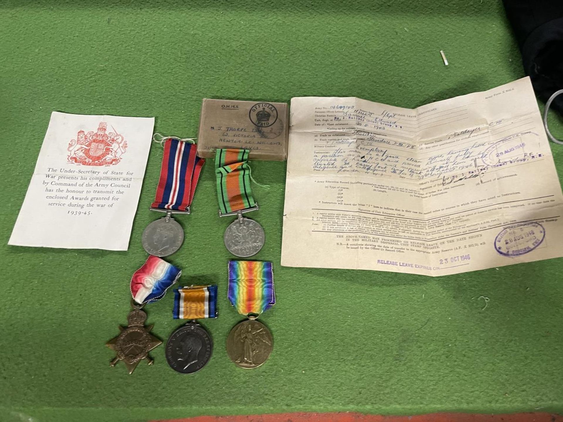 A WW1 MEDAL PAIR AWARDED TO 34260 PRIVATE E UNSWORTH R.A.M.C. TWO WWII MEDALS WITH PAPERWORK.