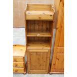 A MODERN DUCAL PINE OPEN STORAGE UNIT WITH CUPBOARD AND DRAWER, 19.5"