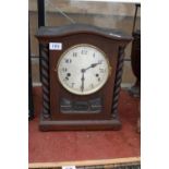 A VINTAGE OAK CASED WESTMINISTER CHIMING MANTLE CLOCK WITH BARLEY TWIST COLUMNS