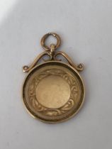 A HALLMARKED 9CT GOLD BIRMINGHAM SPORTING FOB INSCRIBED "L & D.C.L CHAMPIONS H.HULME 1920" MAKERS