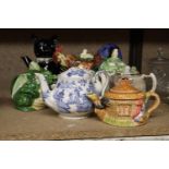 ACOLLECTION OF EIGHT TEAPOTS TO INCLUDE NOVELTY