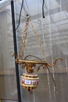 A DECORATIVE BRASS LIGHT FITTING DEPICTING CHERUBS ETC