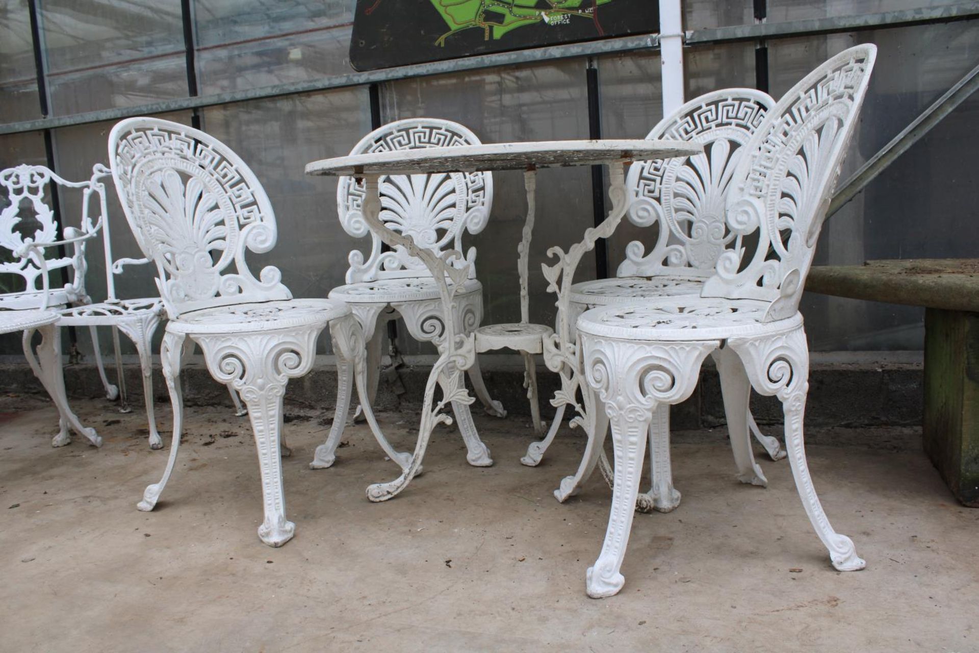A VINTAGE CAST ALLOY BISTRO SET COMPRISING OF A ROUND TABLE AND FOUR CHAIRS - Image 3 of 6