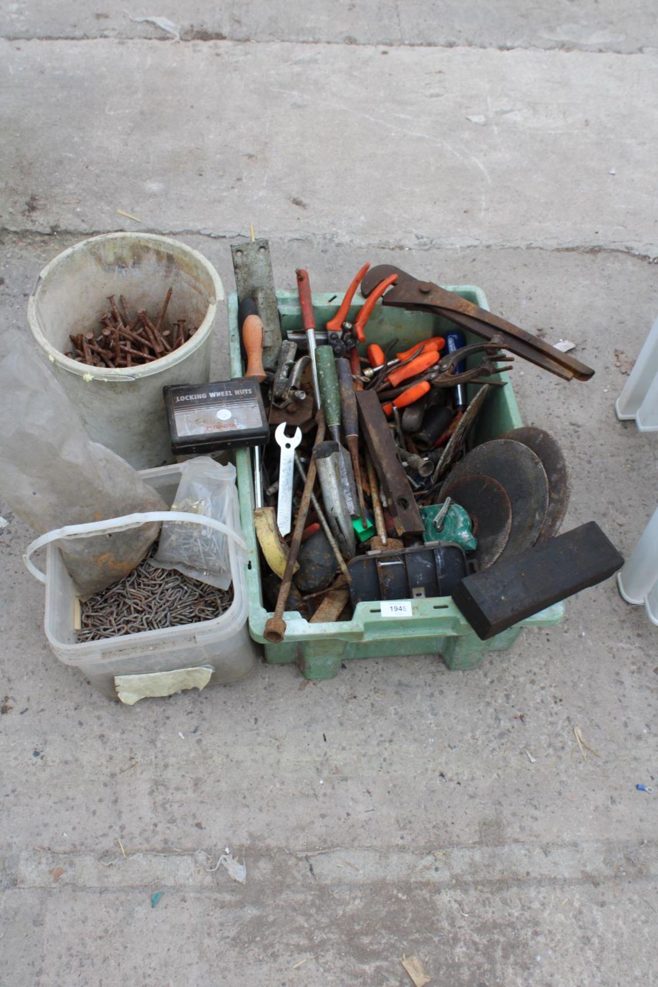 AN ASSORTMENT OF TOOLS AND HARDWARE TO INCLUDE NAILS, STAPLES AND HAND TOOLS ETC