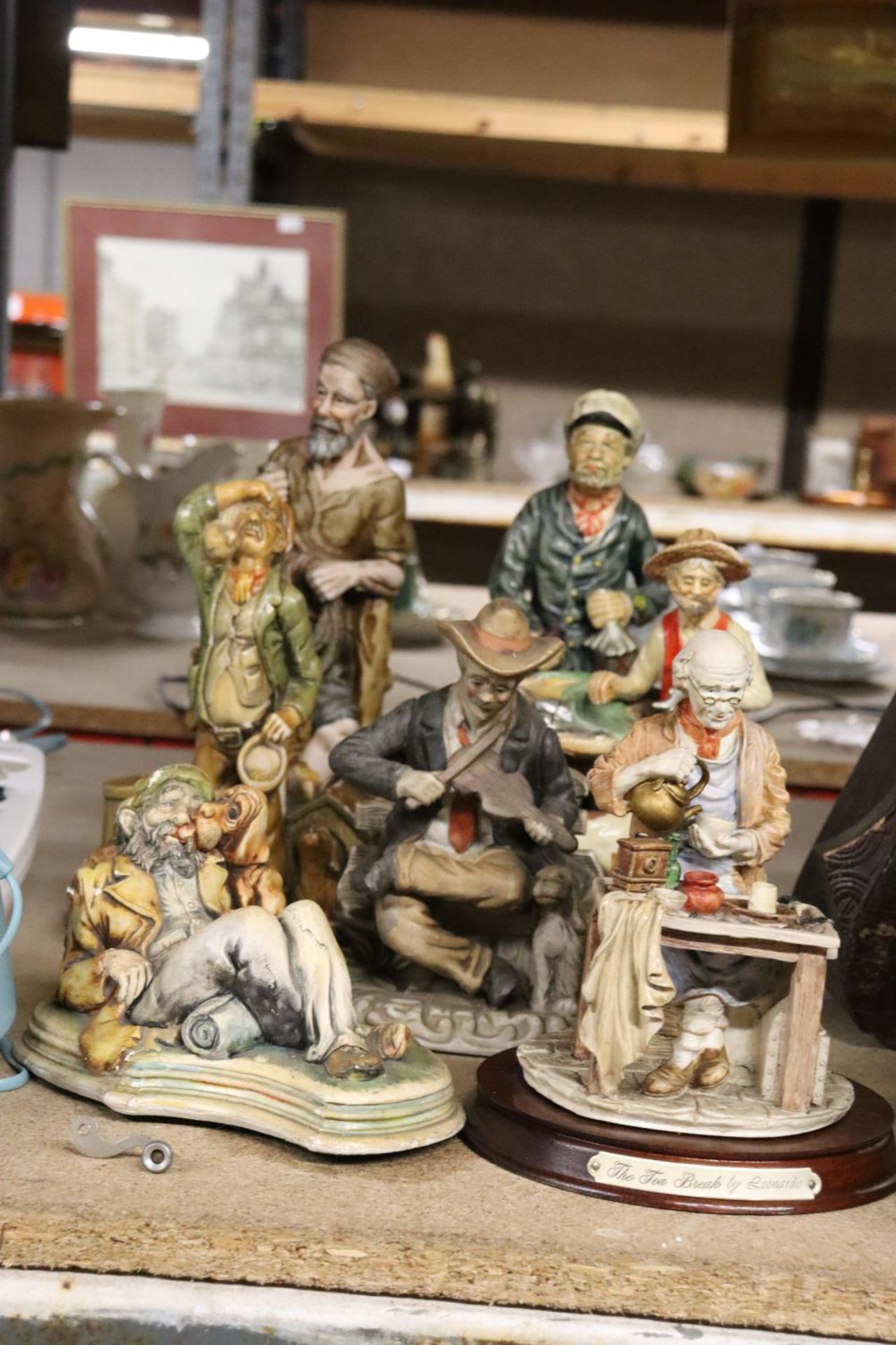 A COLLECTION OF CAPODIMONTE STYLE FIGURES TO INCLUDE LEONARDO, ETC