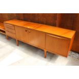 A McINTOSH RETRO TEAK SIDEBOARD ENCLOSING 3 DRAWERS AND 3 CUPBOARDS, 84" WIDE