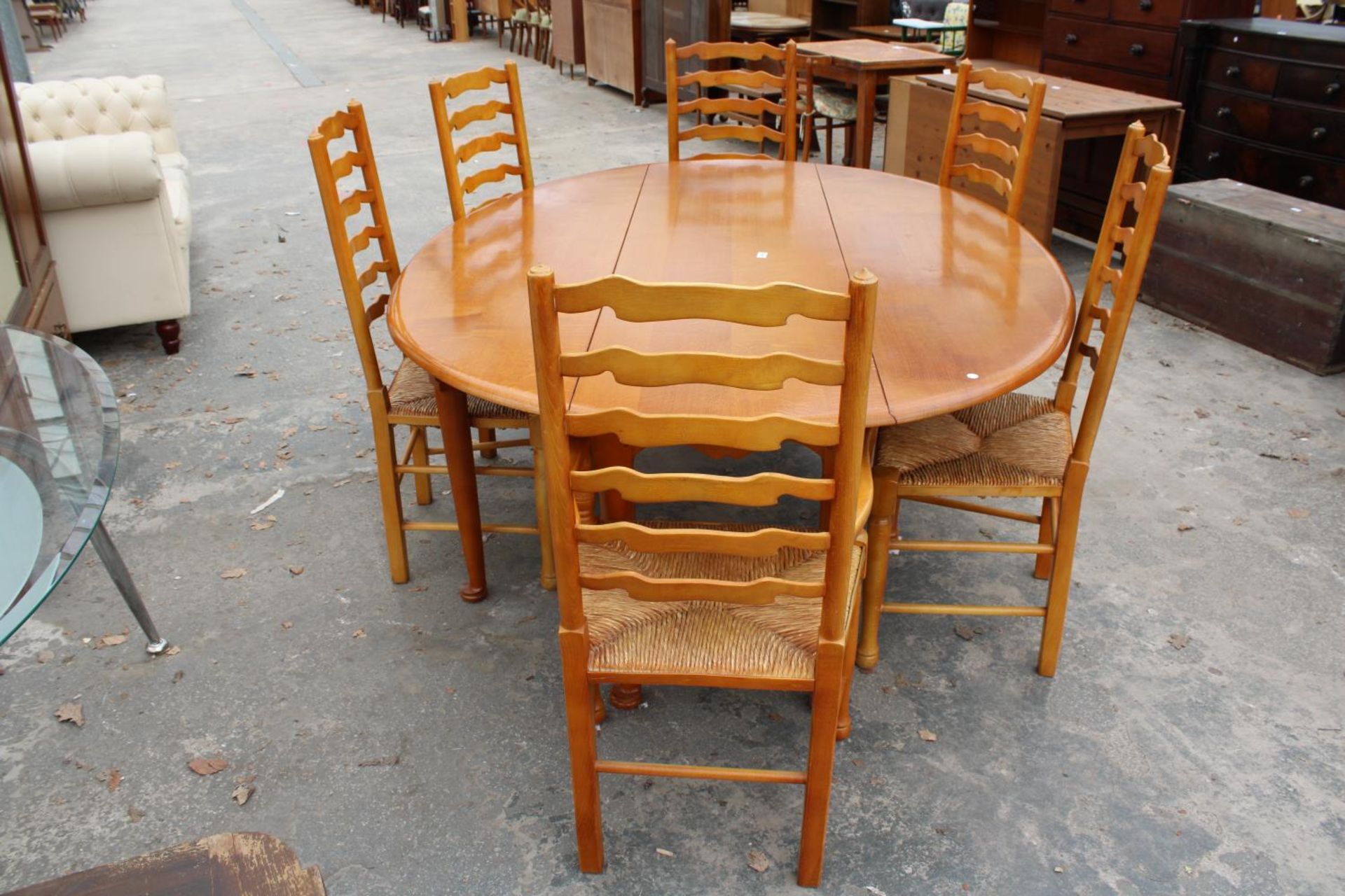 A GEORGIAN STYLE OVAL OAK WAKES TABLE, 77" X 59" OPENED AND SIX LADDER BACK DINING CHAIRS WITH - Image 2 of 9