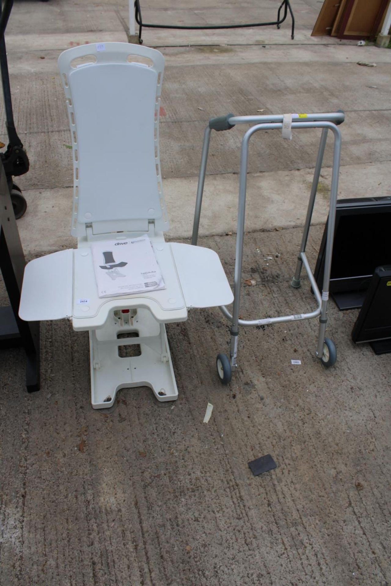 A DRIVE BATH LIFT AND A ZIMMER FRAME