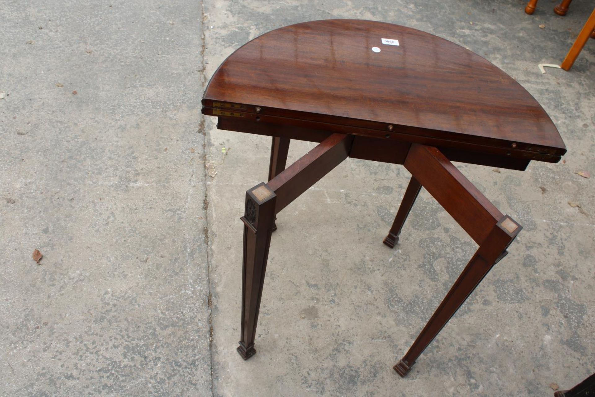 A 19TH CENTURY STYLE DEMI-LUNE GAMES TABLE, POSSIBLY BY WARING AND GILLOW, 28" WIDE - Image 6 of 6