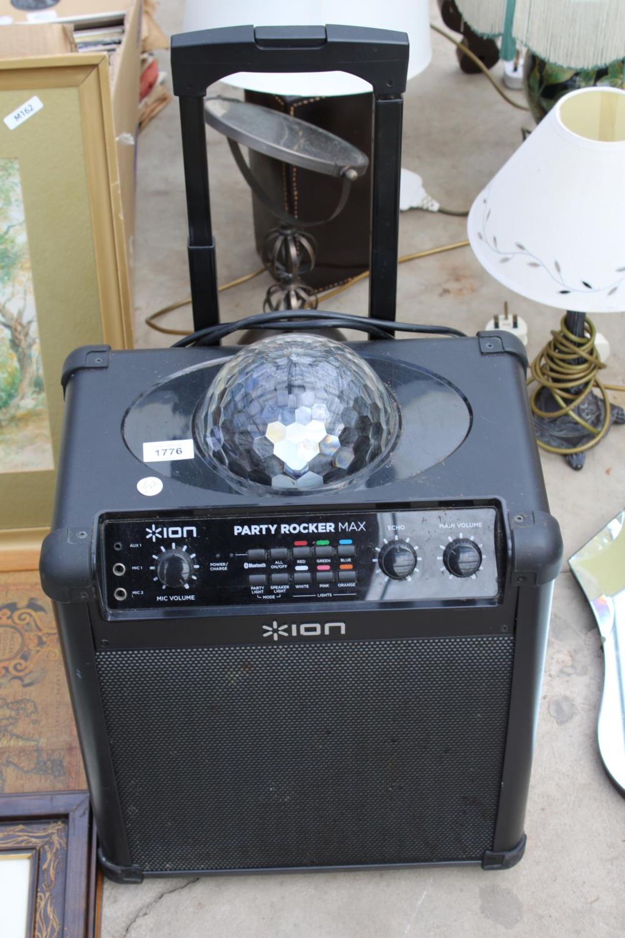 AN ION PARTY ROCKER MAX SPEAKER AND DISCO LIGHT