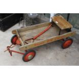 A VINTAGE TRI-ANG 'BIG CHIEF' FOUR WHEELED PULL ALONG CHILDS CART