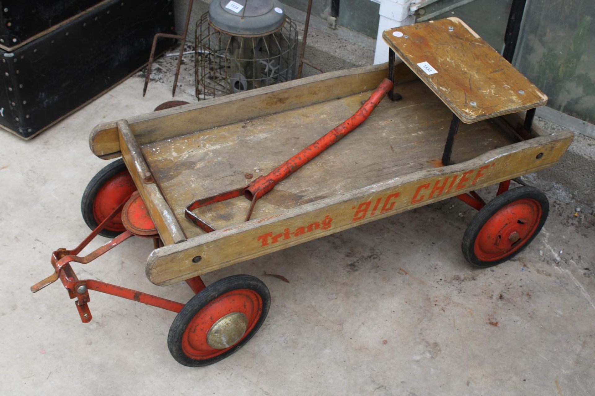 A VINTAGE TRI-ANG 'BIG CHIEF' FOUR WHEELED PULL ALONG CHILDS CART